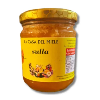 Miele sulla in barattolo di vetro